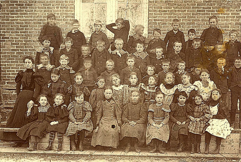 Photo belonged to Erwin J. Nelson who attended school in Waupaca. The school picture was probably taken at the old grade school right in Waupaca. E.J. Nelson grew up on Ware street in the 3rd ward. The names were written on the back by E. J. and it is believed the (D) meant the person had died when EJ put the names on the back of the picture. It was difficult to read many names so names may be misspelled. Photo submiited by Joan Murray jojermurray@earthlink.net